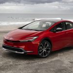2023-Toyota-Prius-red-front-three-quarter-at-the-beach