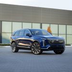 A front 3/4 view of the 2026 Cadillac VISTIQ in Opulent Blue Metallic.