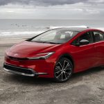 2023-Toyota-Prius-red-front-three-quarter-at-the-beach