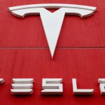FILE PHOTO: The logo of car manufacturer Tesla is seen in Bern, Switzerland